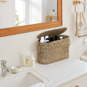 StorageWorks flip-top cover keeps moisture and dust away in busy bathrooms.