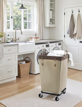 StorageWorks light khaki laundry basket designed for dorms and homes.