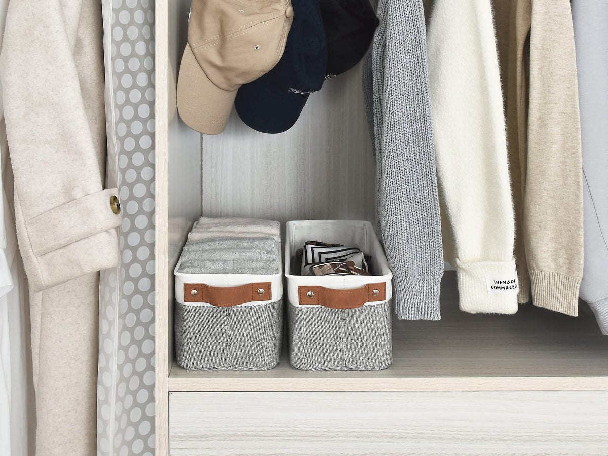 StorageWorks narrow bin in a laundry area, supporting folded laundry and small items.