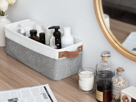StorageWorks narrow bin with towels, perfect for linen closet organization.