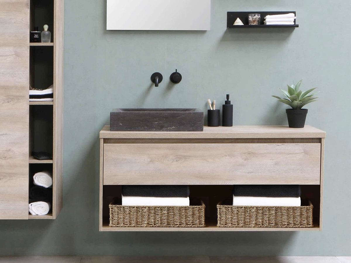 StorageWorks seagrass tray displayed in living room for remote storage.
