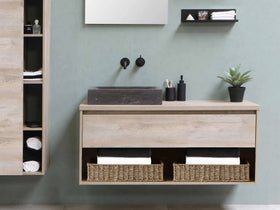 StorageWorks seagrass tray displayed in living room for remote storage.