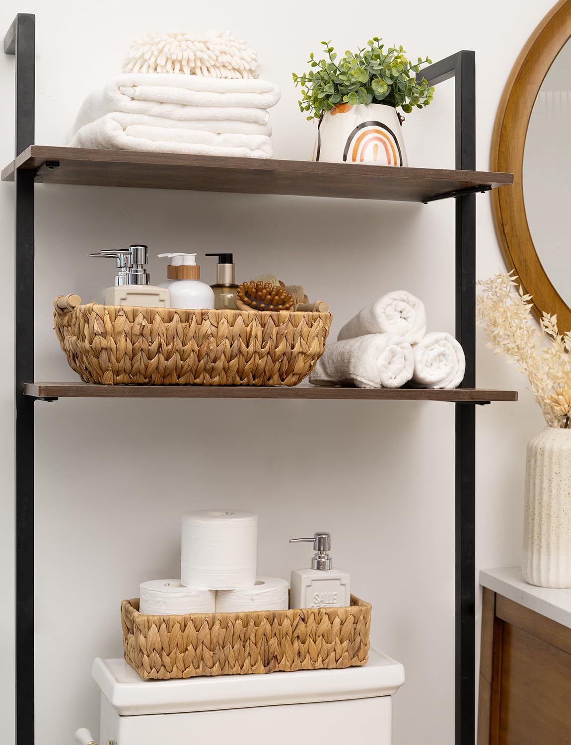 Stackable StorageWorks baskets with wooden handles on a shelf