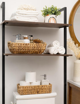 Stackable StorageWorks baskets with wooden handles on a shelf