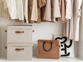 StorageWorks stackable storage basket shown on a shelf for efficient organization.