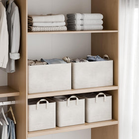 StorageWorks fabric bin filled to show generous capacity for clothes and towels
