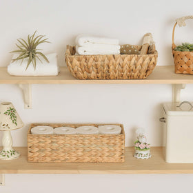 StorageWorks bathroom basket on tank top adds natural texture and function.