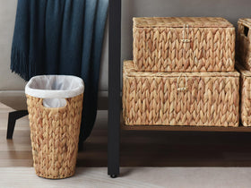 StorageWorks Wicker Waste Basket complements living room decor and organization.