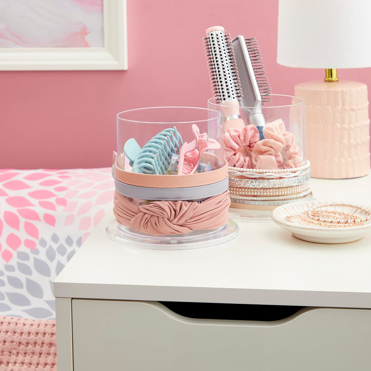 STORi Bella round storage bin neatly corrals hair ties and clips.