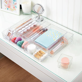 STORi SimpleSort bathroom organizers hold cosmetics and grooming tools in order.