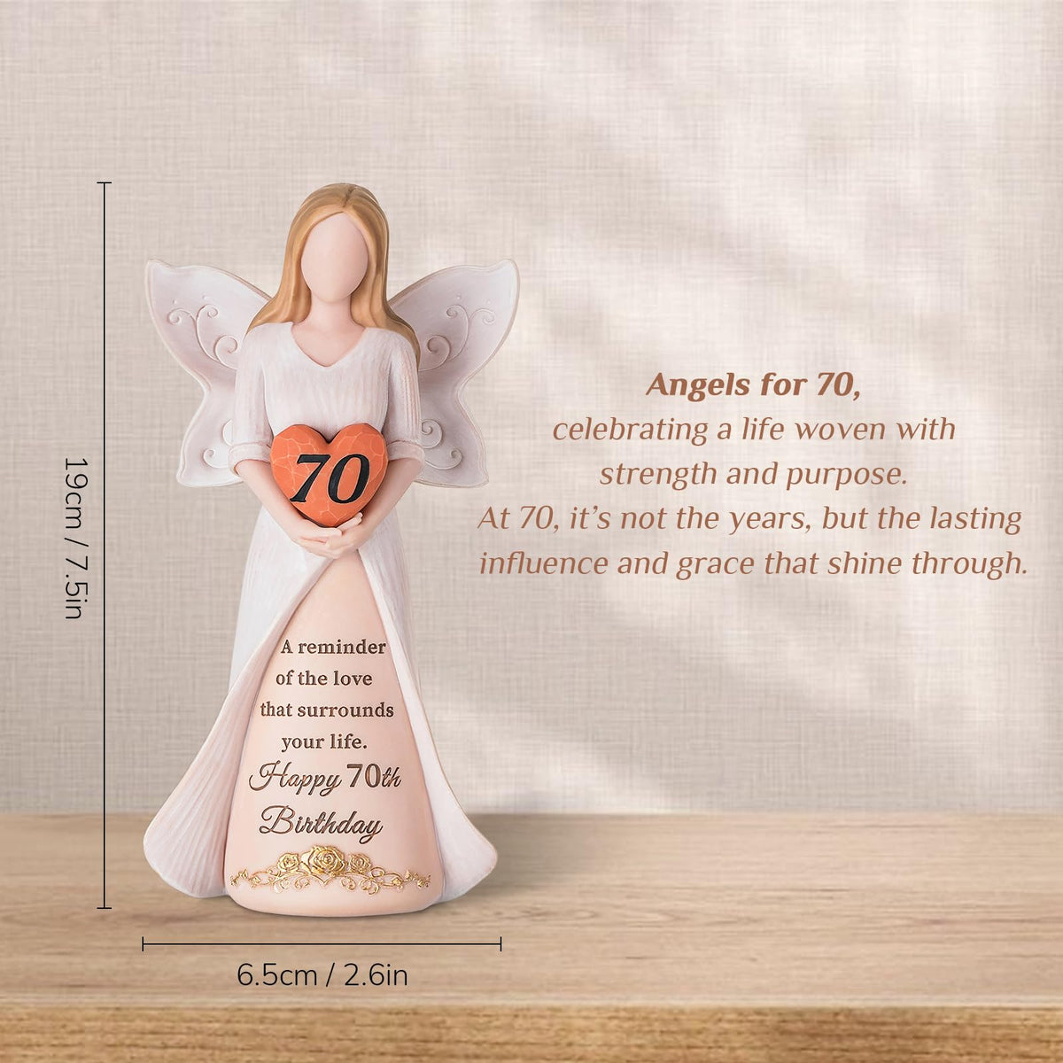 Storieme 70th birthday angel sculpture close-up shows hand-painted details and vibrant finish.
