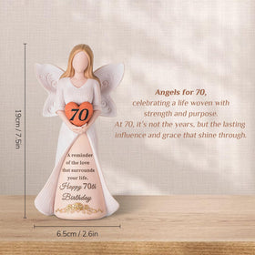 Storieme 70th birthday angel sculpture close-up shows hand-painted details and vibrant finish.