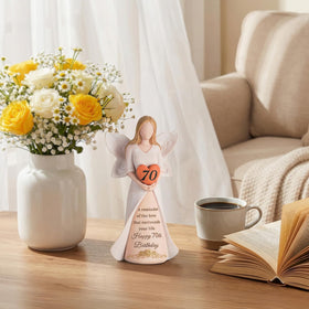 Storieme angel sculpture resting on desk for desk-top celebration.