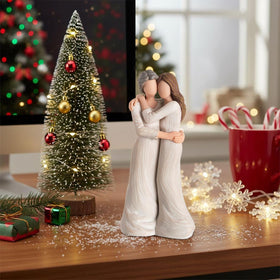 Storieme elegant resin sculpture doubles as warm home decor and cherished keepsake.