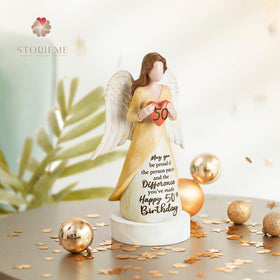 Storieme hand-painted 50th birthday angel figurine adds colorful home decor.