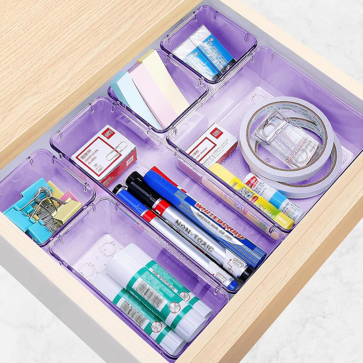 StorMiracle clear bins in a drawer reveal contents at a glance.