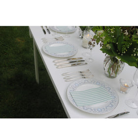 Stxy's Sage napkins on a dining setup showing soft 3-ply texture