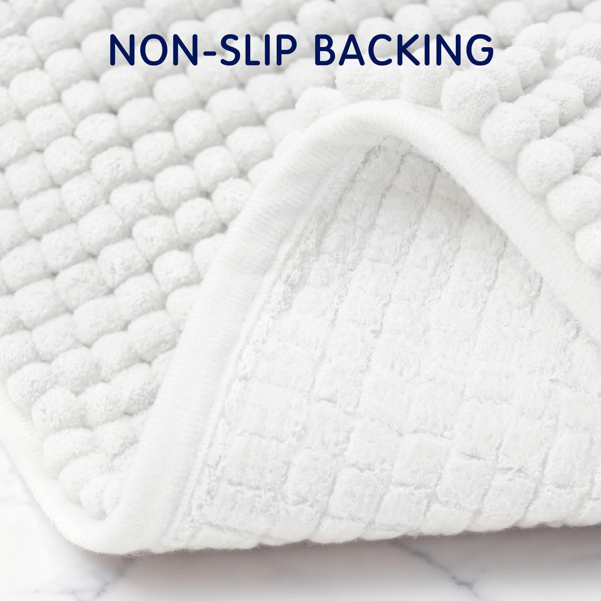 SUBRTEX absorbent bath mat traps moisture to keep floors drier.