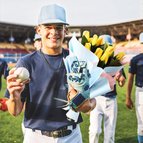 Suhine softball rose bouquet decor, adds sport-theme charm to living spaces.
