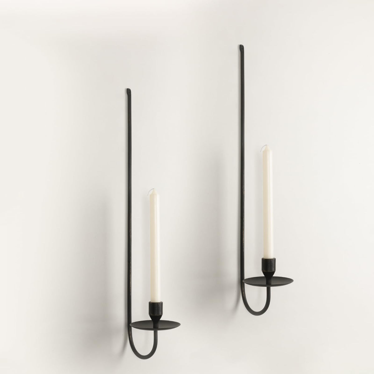 SUJUN 24.8-inch iron wall candle sconce set adds modern elegance to walls.