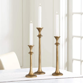 SUJUN antique-brass finish candle stands add vintage charm to dining spaces.