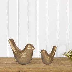 SUJUN medium brass bird statue on shelf with cotton-padded bottom.