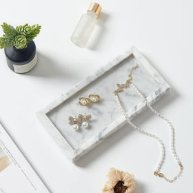 Sumlus marble tray resting on a dresser offers stable support.
