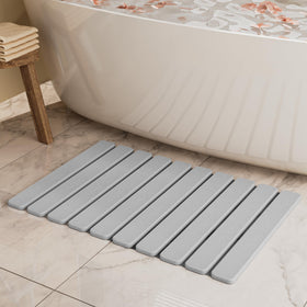 Summer-Kiss foldable stone bath mat showing absorbent surface for quick bathroom drying.