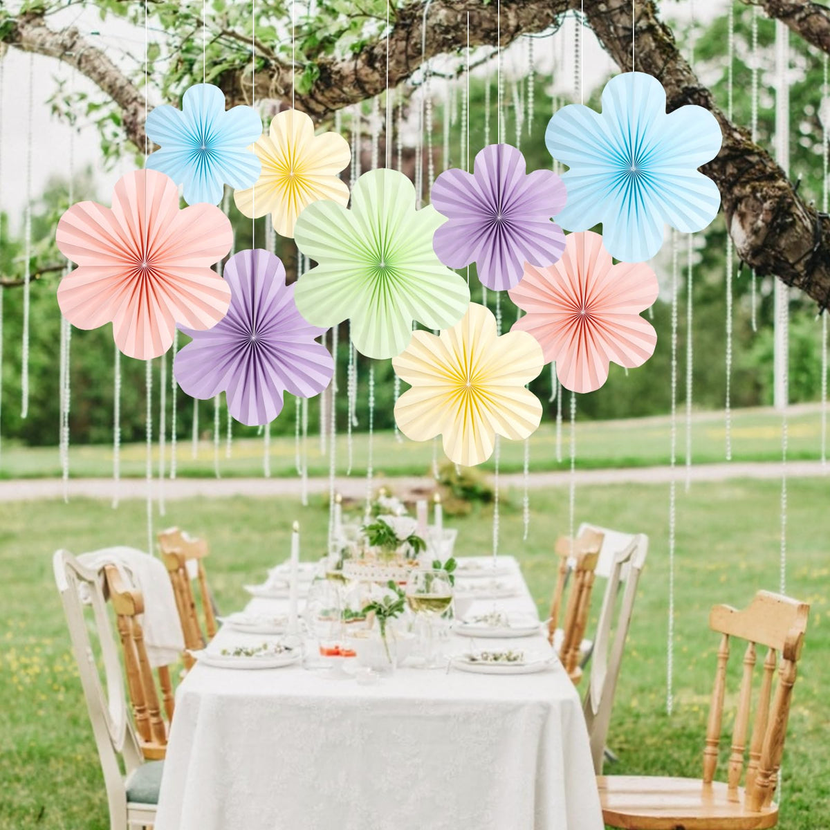 SUNBEAUTY baby shower decor with pastel paper fans creates soft, festive vibes