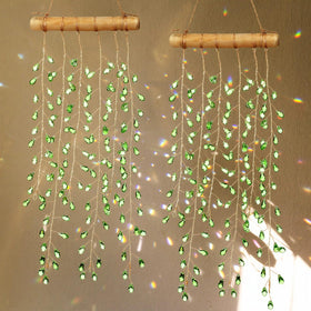 Suncalla green crystal suncatcher casts gentle rainbows indoors