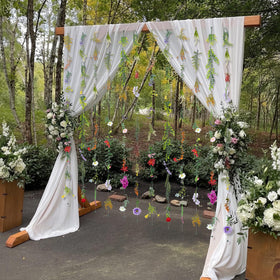 Suncalla wedding arch garland in multicolor florals for vibrant themes.