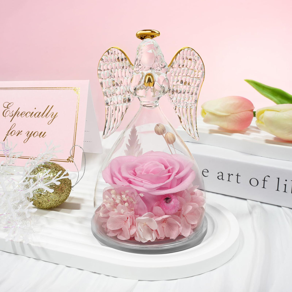 Sunia glass dome protects the angel while keeping the rose visible.