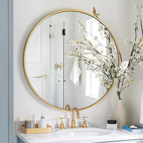 Sunniry gold brushed-frame circle mirror elevates vanity area with refined detail
