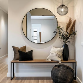 Sunniry round bathroom mirror fits compact spaces with a clean look.