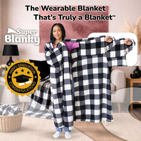 Super Blanky oversized wearable blanket drapes over the couch for comfort