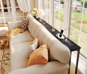 Superjare hidden storage behind the sofa keeps essentials within reach.