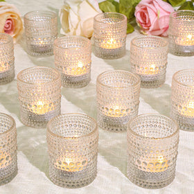 SUPMIND clear glass votive holders used as a table centerpiece for warm ambience