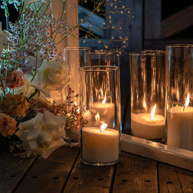 SUPMIND hurricane candle holder vases create warm ambient light.