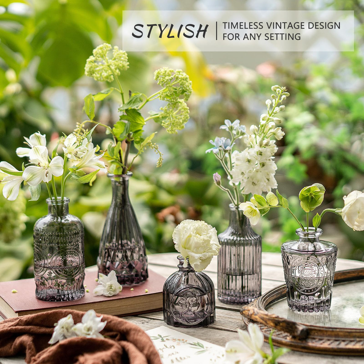 SUPMIND Thick-glass bud vase in black highlights flowers with durable, shimmering finish.