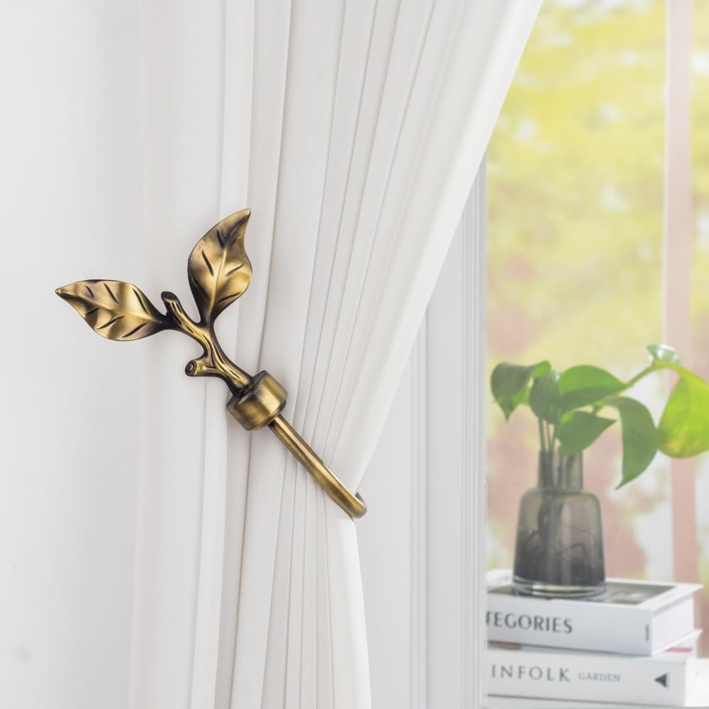 SUQ I OME bronze finish curtain holders blend with blinds and drapes.