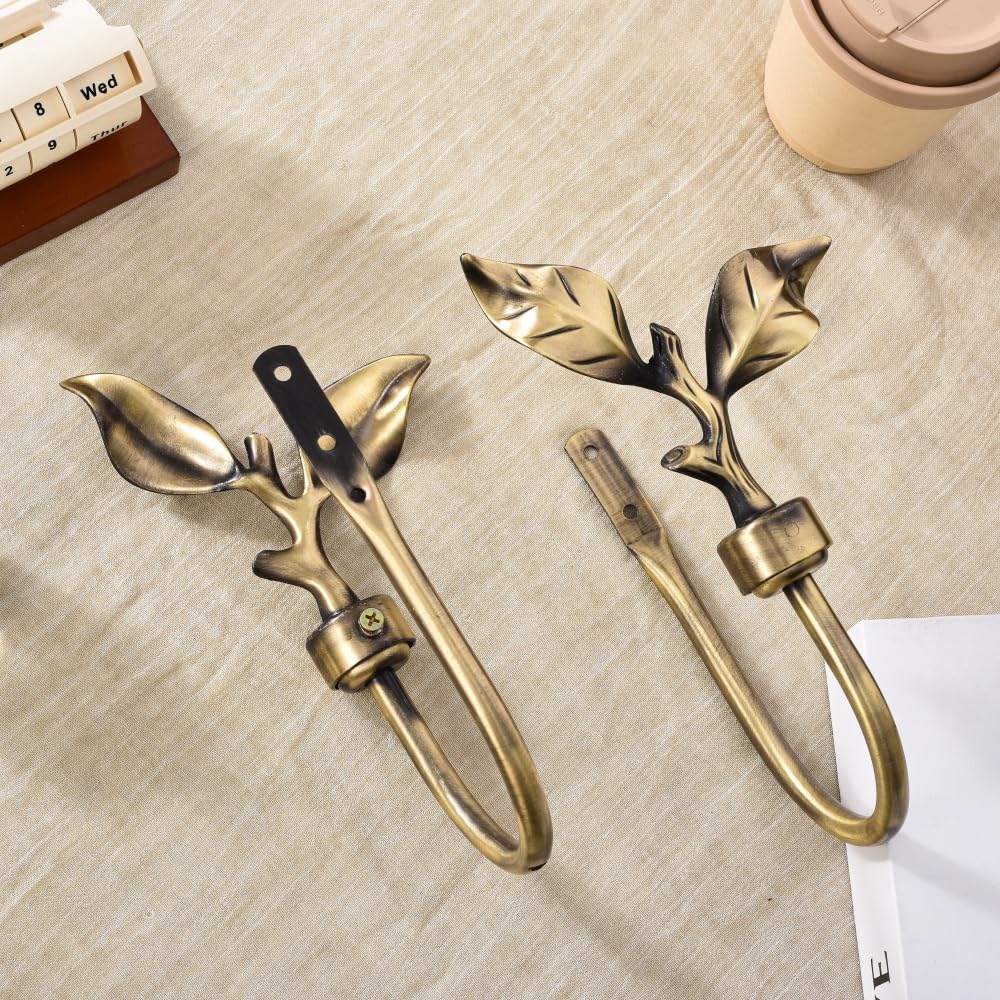 SUQ I OME wall-mount holdbacks in bronze finish provide sturdy drapery support.