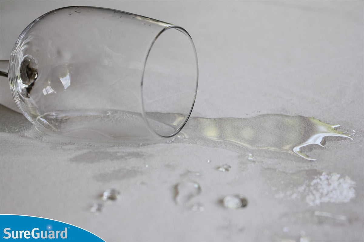 SureGuard protector side skirt fit demonstrates a snug, deep-pocket design for secure mattress coverage.