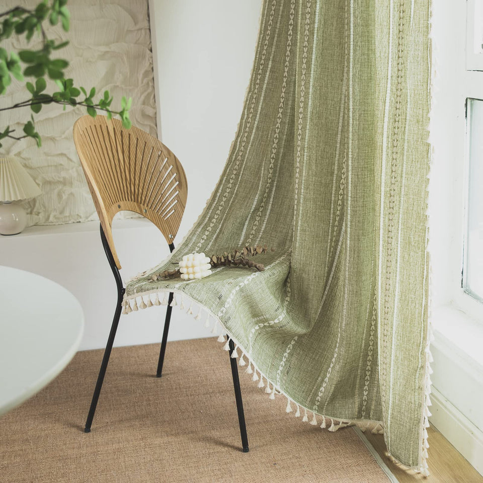 Sutuo Home boho curtains in sage green frame a cozy bedroom with soft light.