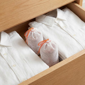 Suwimut cedar sachets in closet and shoe cabinet refresh daily.