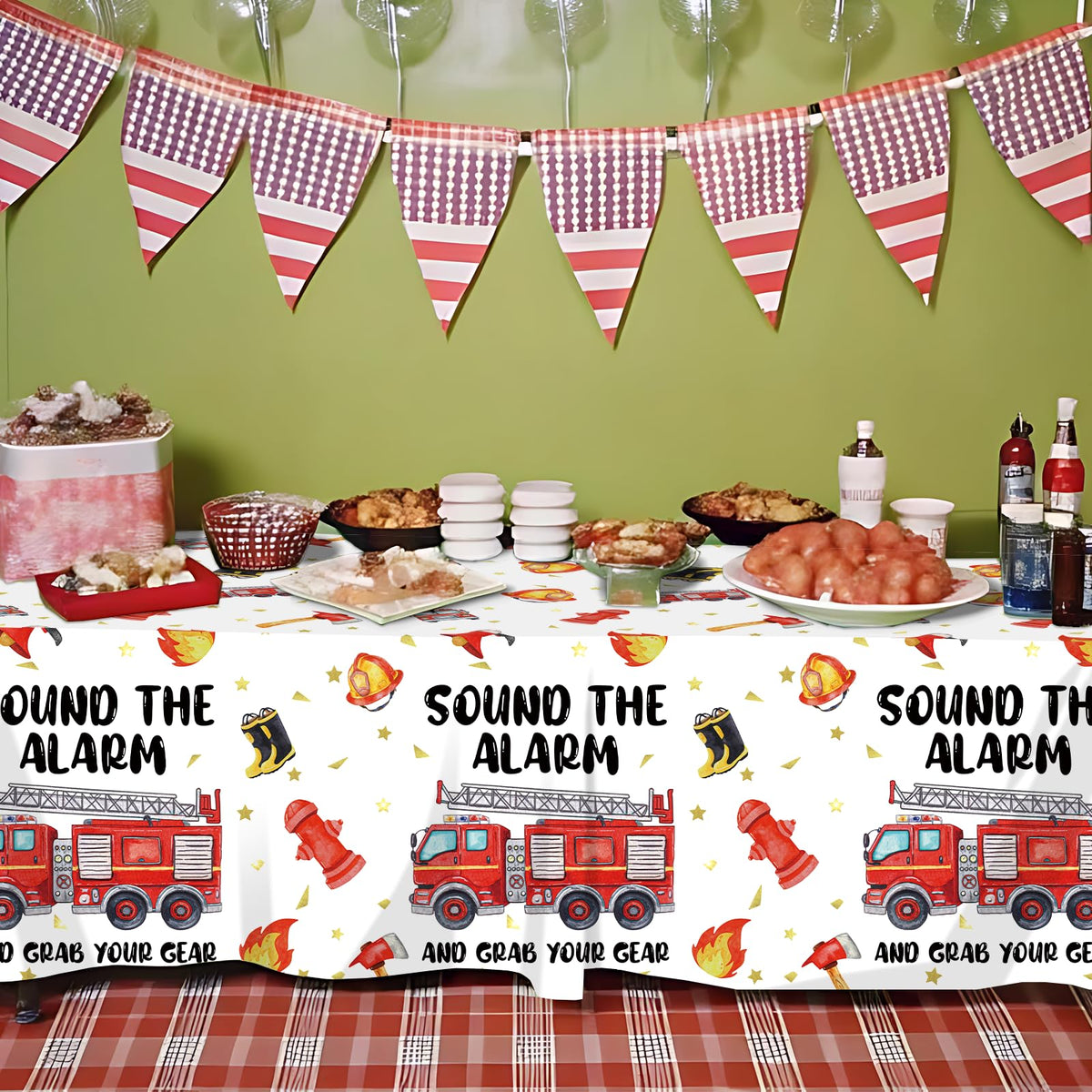 Suzkoqo firetruck tablecloth ties the theme together while protecting surfaces.