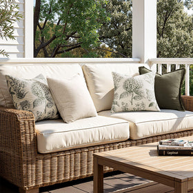 SWANCOCO hydrangea pillow cover enhances reading chair styling with farmhouse warmth.