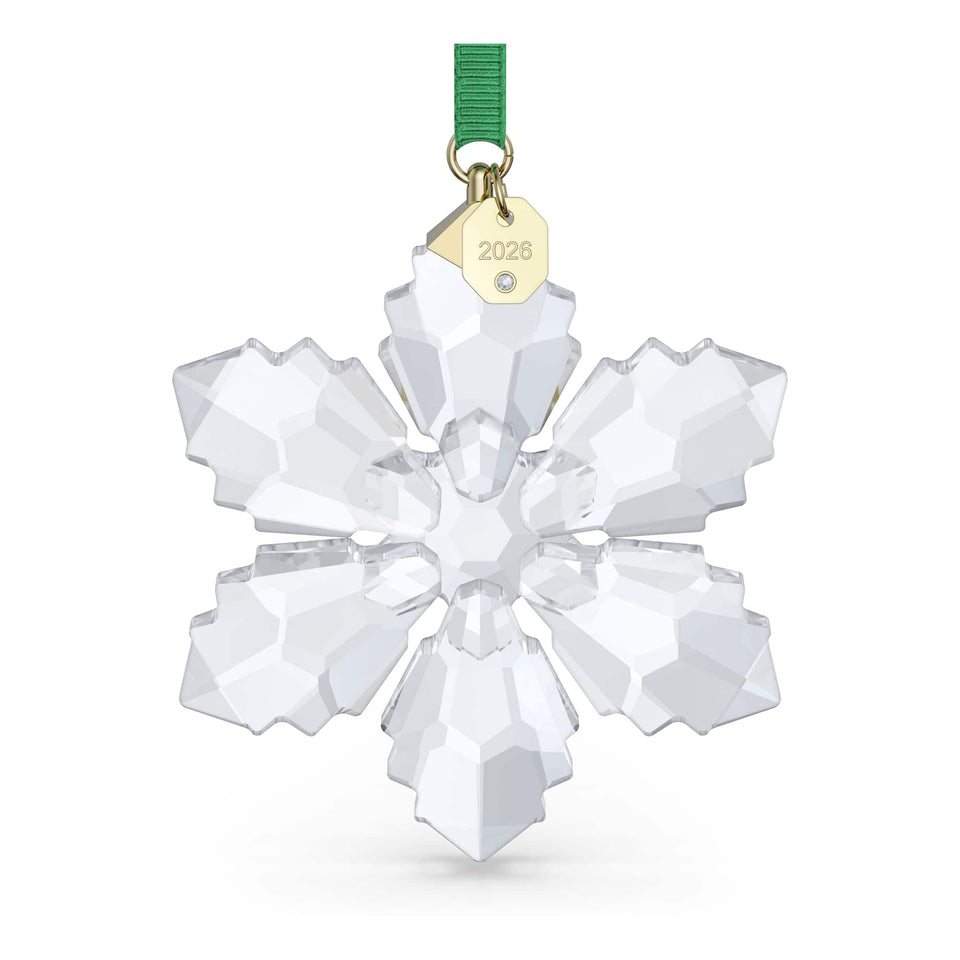 Swarovski Annual Edition Ornament 2026 geometric snowflake on green ribbon adds festive sparkle.