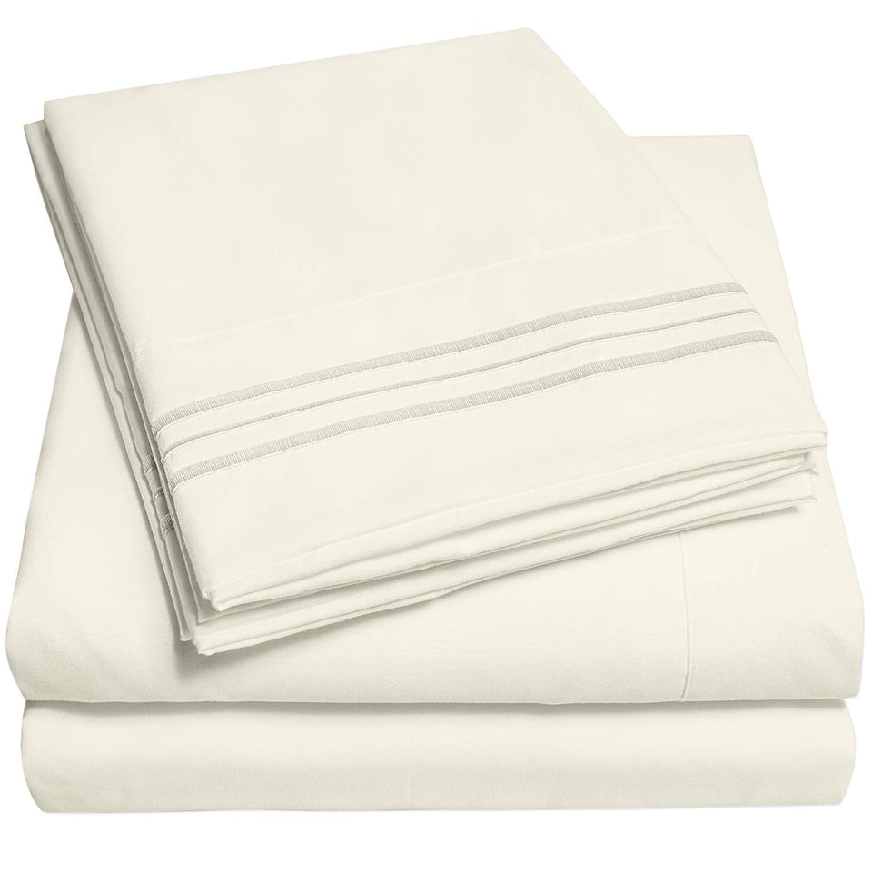 Sweet Home Collection 1500 Supreme Queen Ivory Sheet Set on a bed with hotel-like luxury.