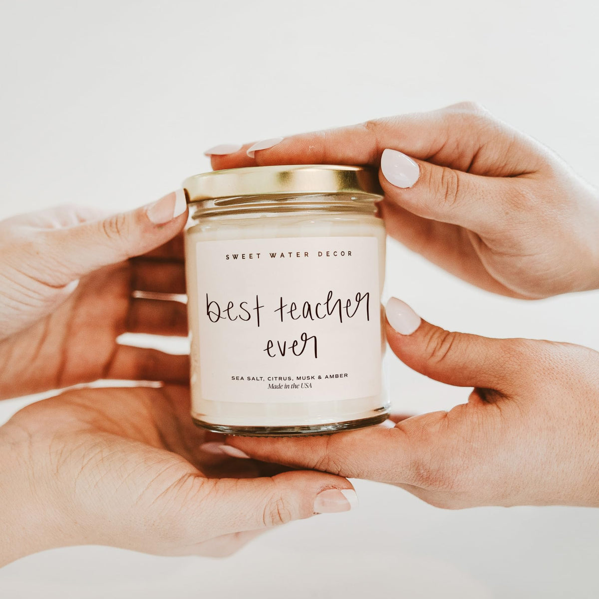 Sweet Water Decor Best Teacher Ever candle offers 40-hour burn for extended enjoyment.