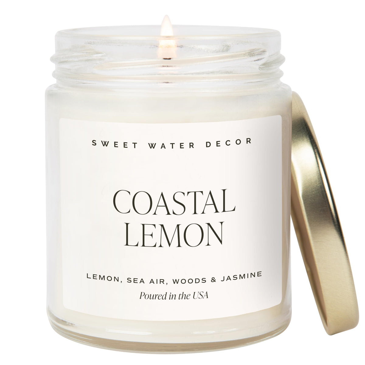 Sweet Water Decor Coastal Lemon candle in a clear jar with gold lid for a fresh coastal aroma.